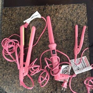 3 piece hair tool set. Pink flat iron , mini size travel iron, curling iron